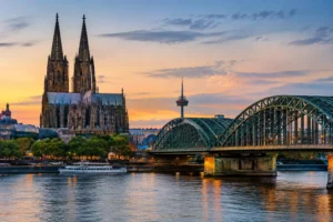 Germany Job Seeker Visa guide with Cologne Cathedral and Hohenzollern Bridge